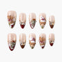 Handmade press-on nails with Christmas teddy bear, Santa hat, snowflake, and gem designs
