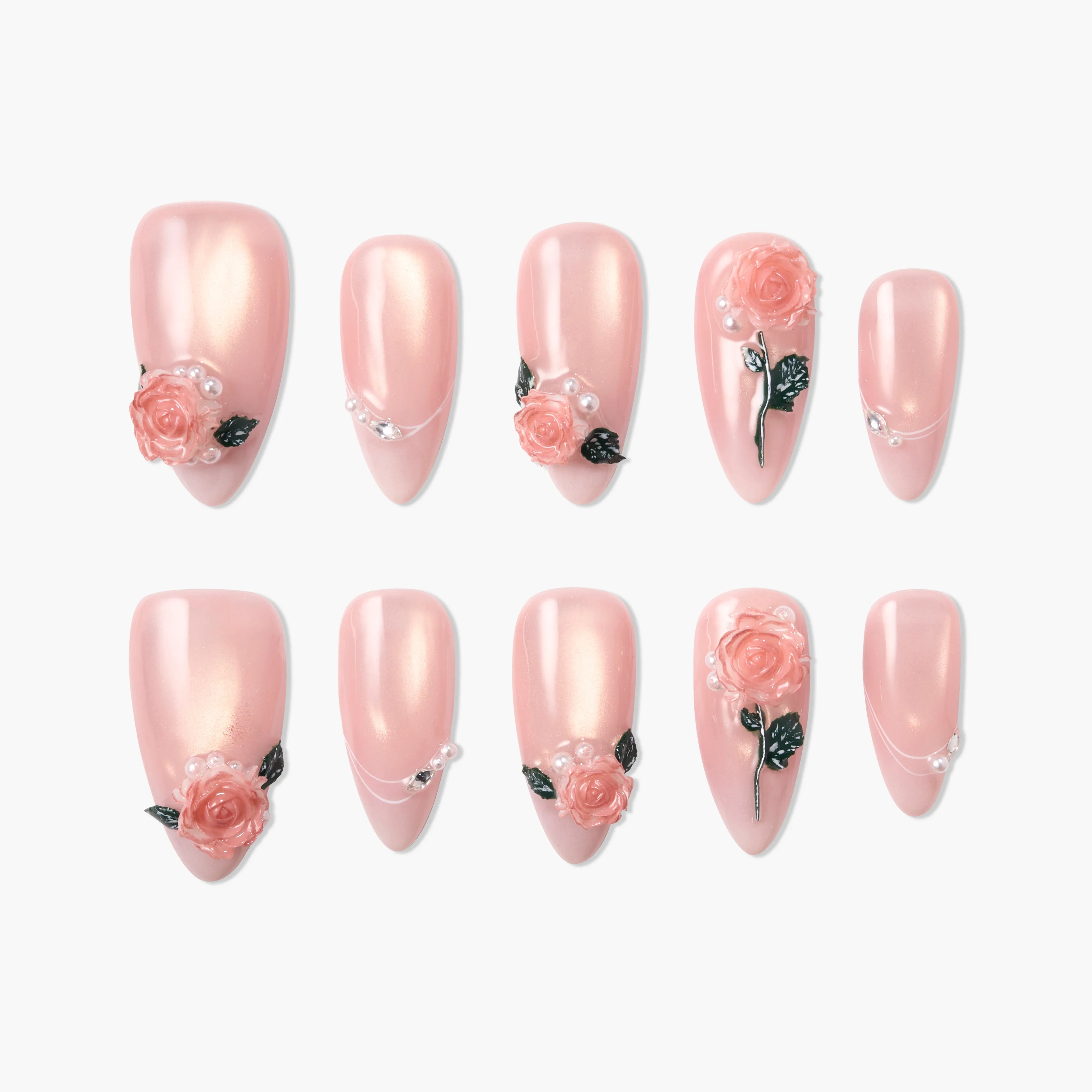 Handmade pink press-on nails with 3D rose flower and pearl designs, arranged on a white background.