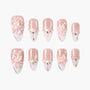 Handmade pink press-on nails with 3D floral designs, pearls, and rhinestone accents
