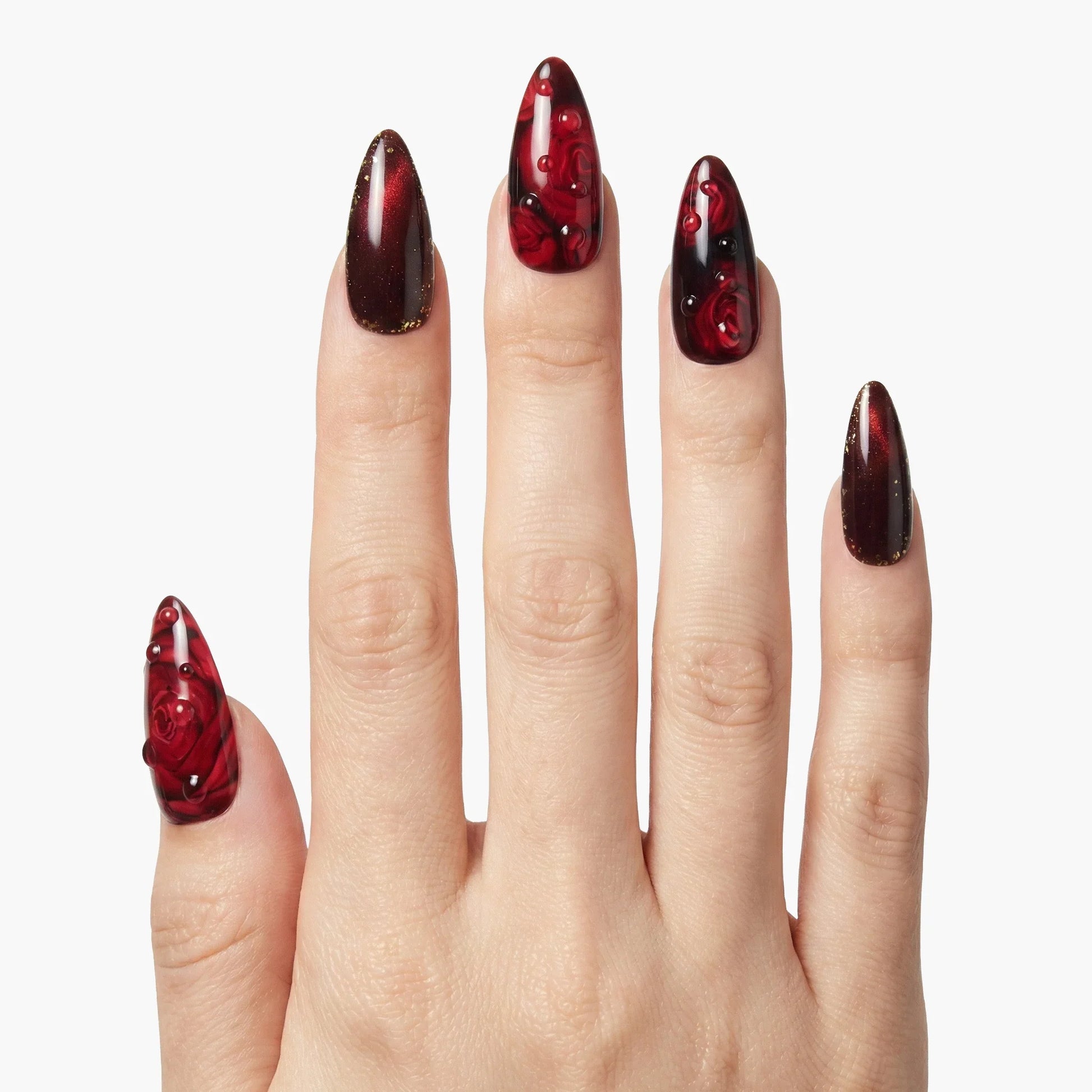 Hand with almond-shaped, red and black 3D rose floral press-on nails