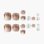 Set of press-on toenails with nude ombre, rhinestones, glitter, and confetti designs