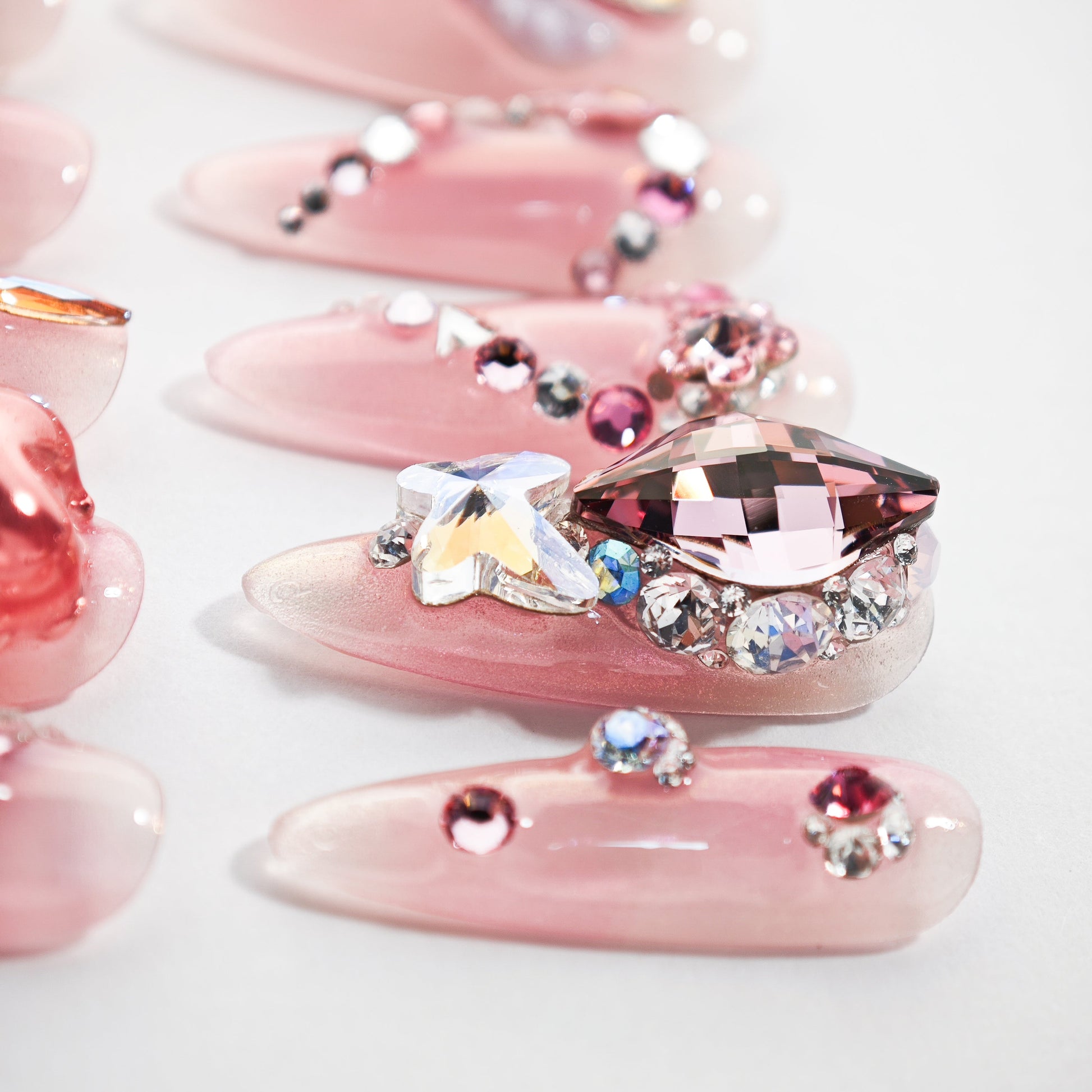Pink handmade press-on nails with 3D rhinestone and crystal embellishments