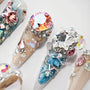 Handmade press-on nails with large rhinestones, 3D gems, beads, and glitter accents