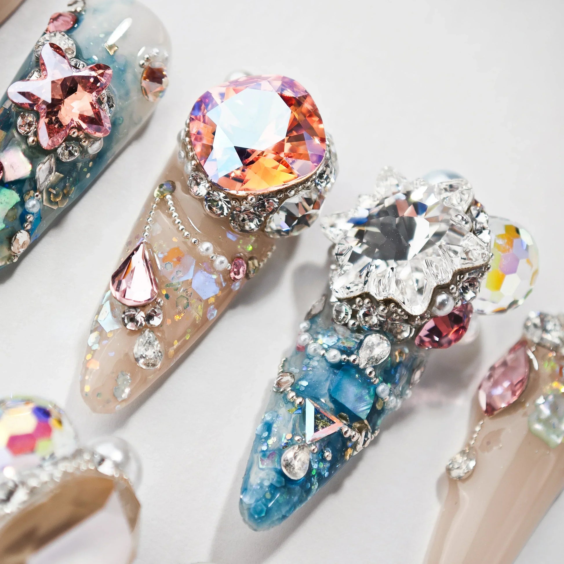 Handmade press-on nails with large rhinestones, 3D gems, beads, and glitter accents