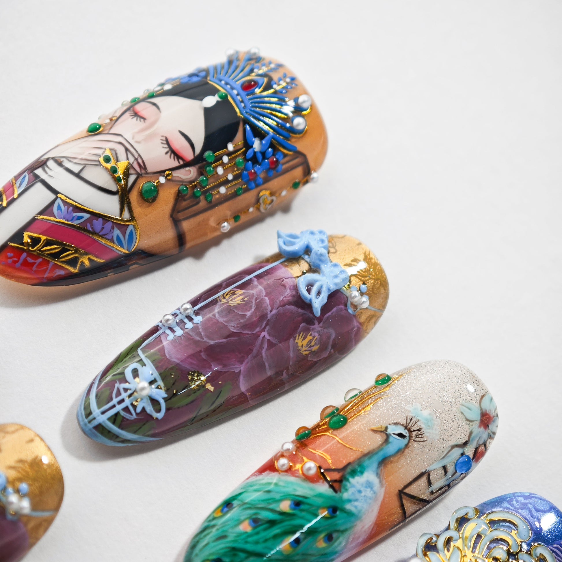 Hand-painted press-on nails with 3D embellishments, floral, peacock, and Asian art designs