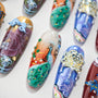 Hand-painted press-on nails with peacock, floral, and intricate jeweled art designs