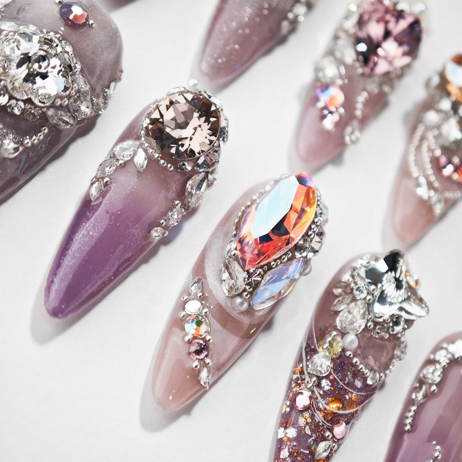 Handmade press-on nails with purple ombre and large 3D rhinestone crystal designs
