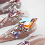 Handmade press-on nails with multicolored crystals, heart gems, and intricate 3D nail art