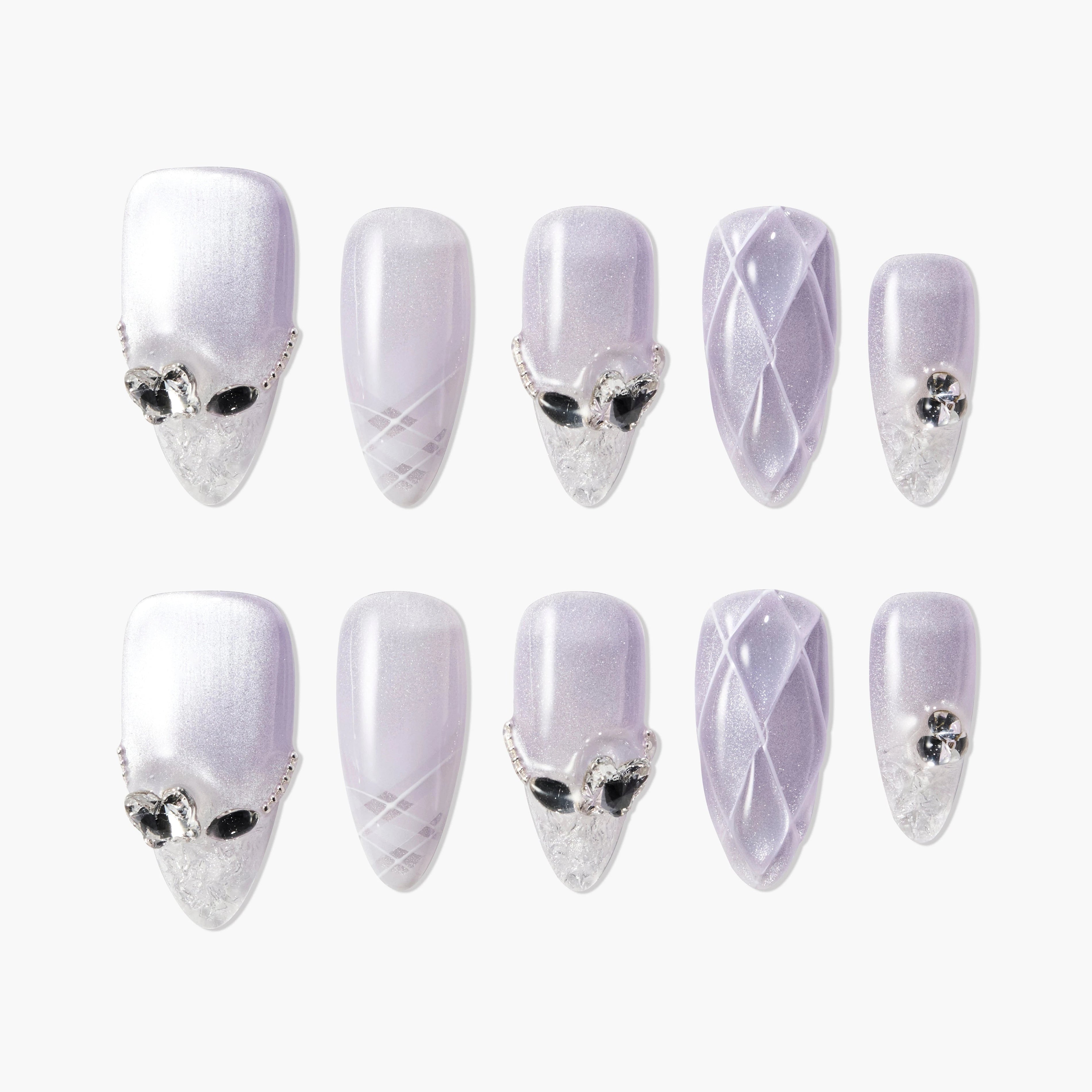 Lilac almond press-on nails with crystal accents, 3D quilted design, and glitter tips.