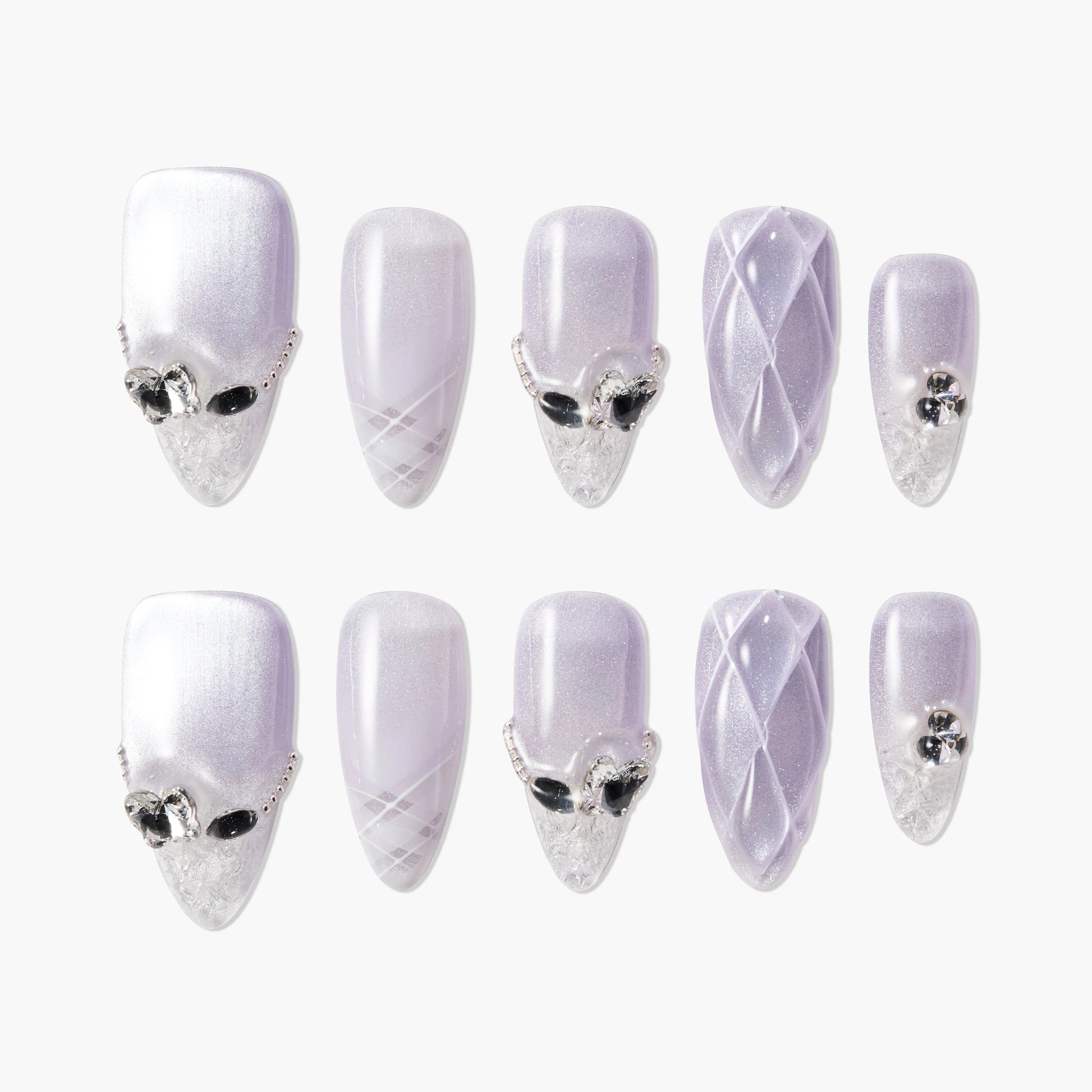 Lilac almond press-on nails with crystal accents, 3D quilted design, and glitter tips.